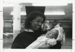 Graduate holding baby, 1983